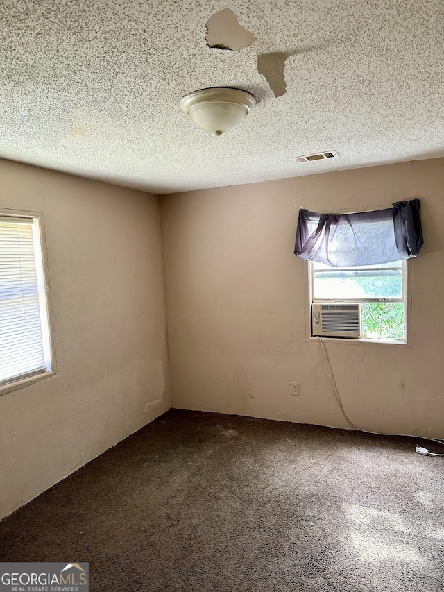 2155 Ferguson St, Macon, GA 31204 - carpeted empty room featuring cooling unit and a textured ceiling