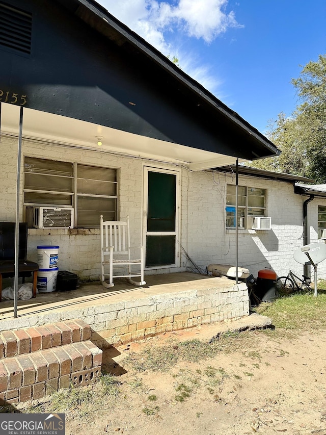 2155 Ferguson St, Macon, GA 31204 - property entrance featuring cooling unit and brick siding