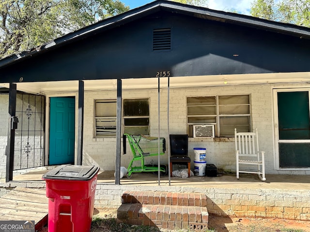 rear view of house with cooling unit