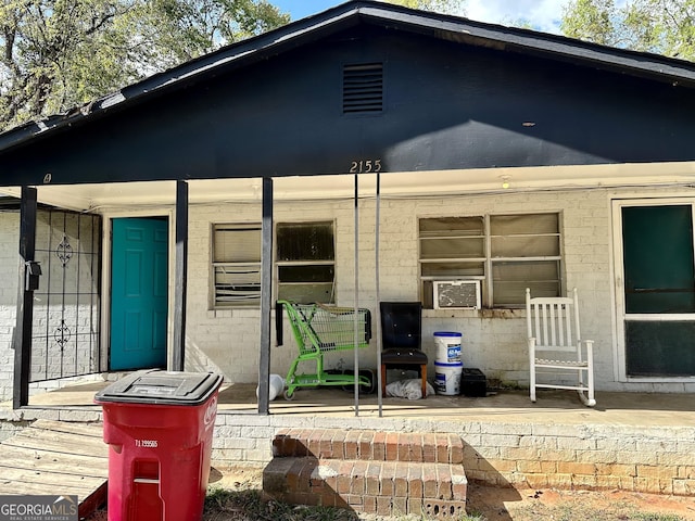 2155 Ferguson St, Macon, GA 31204 - view of exterior entry with a porch and brick siding