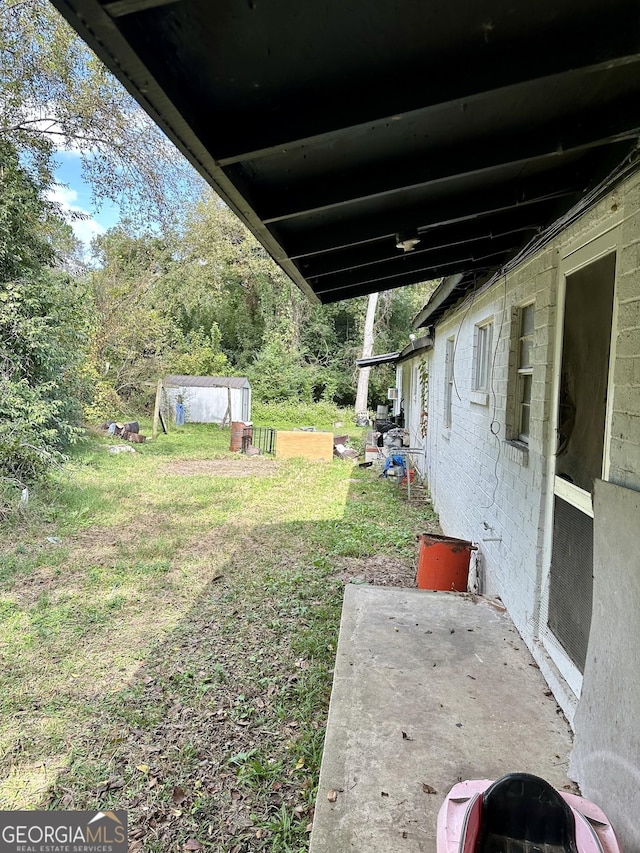 2155 Ferguson St, Macon, GA 31204 - view of grassy yard with a patio