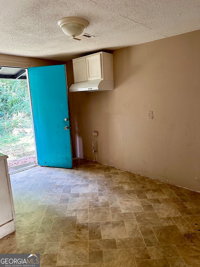 kitchen featuring a textured ceiling