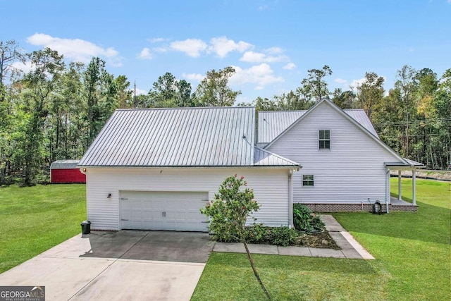 view of home's exterior featuring a garage and a lawn