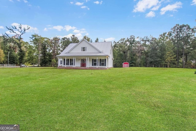 view of front of house with covered porch and a front lawn