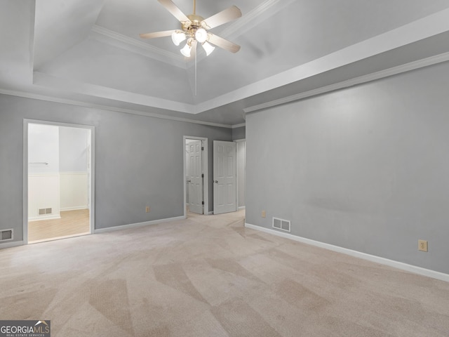 unfurnished bedroom with crown molding, visible vents, and light colored carpet