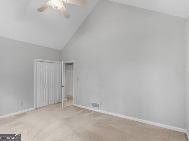 unfurnished bedroom featuring light carpet, baseboards, visible vents, ceiling fan, and high vaulted ceiling