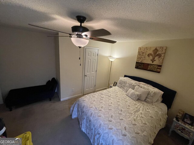 bedroom featuring ceiling fan, carpet, and a textured ceiling