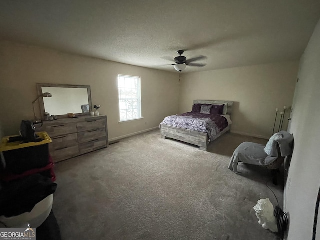 bedroom with ceiling fan and carpet floors