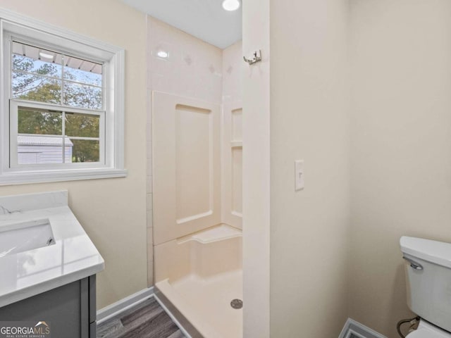 239 Brown Dr, Clermont, GA 30527 - full bathroom with walk in shower, vanity, and wood finished floors