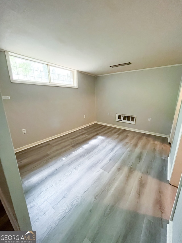 interior space with hardwood / wood-style floors and a healthy amount of sunlight