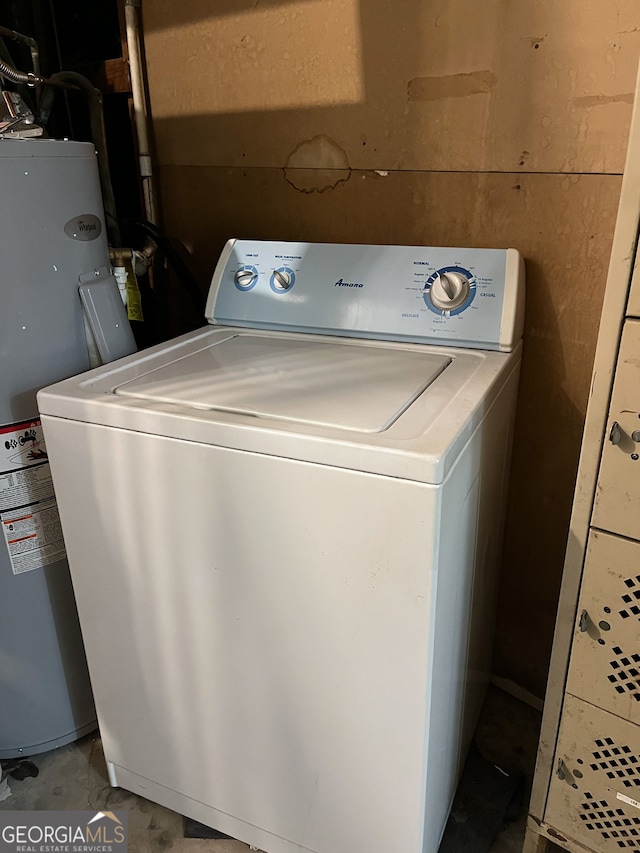 clothes washing area with washer / dryer