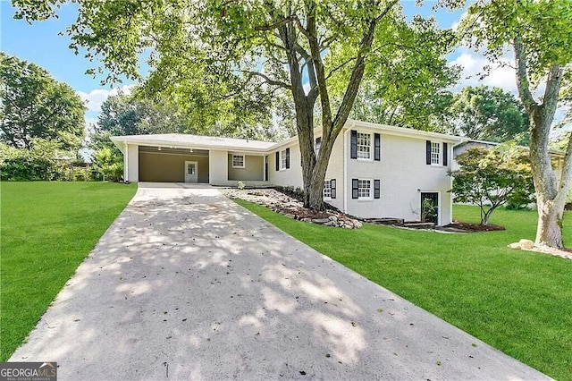 split level home featuring a carport and a front lawn