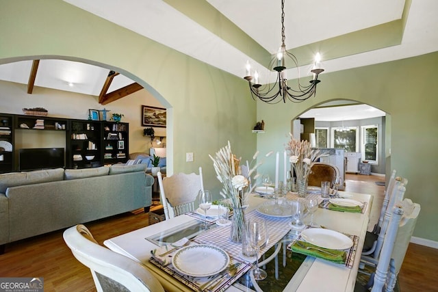 14 Rivendell Way, Hayesville, NC 28904 - dining area featuring arched walkways, a chandelier, and wood finished floors