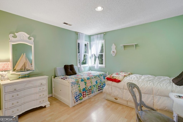 14 Rivendell Way, Hayesville, NC 28904 - bedroom with wood finished floors, a textured ceiling, and recessed lighting