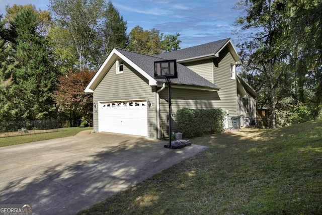 view of home's exterior featuring a garage and a yard