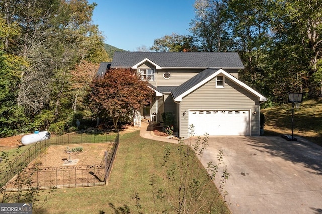 view of front of home with a garage and a front lawn