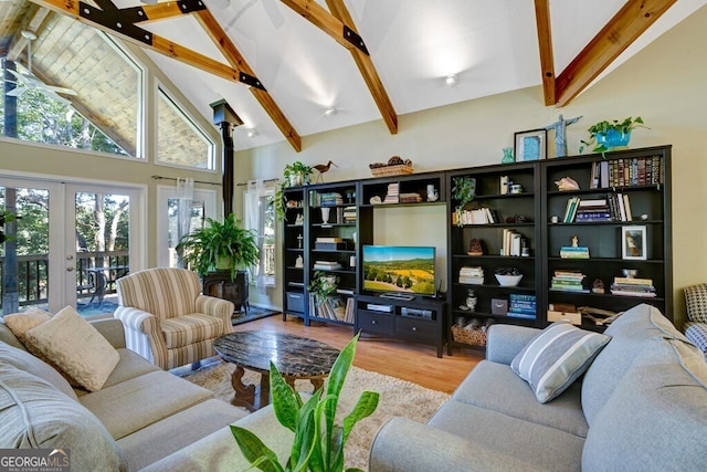 living room with high vaulted ceiling, light wood-type flooring, french doors, and beam ceiling