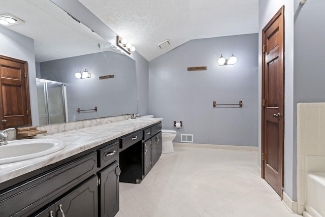 full bathroom featuring vanity, a textured ceiling, vaulted ceiling, separate shower and tub, and toilet