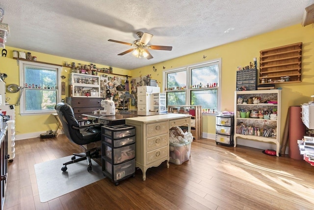 office with wood-type flooring, a textured ceiling, and ceiling fan