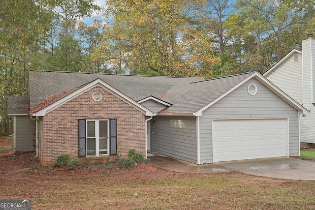 ranch-style house featuring a garage