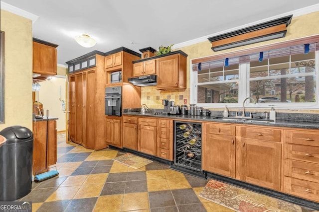 kitchen with sink, ornamental molding, backsplash, beverage cooler, and stainless steel oven