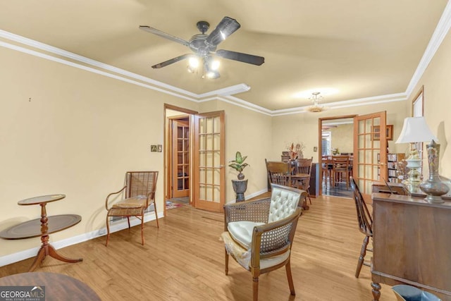 sitting room with ceiling fan, light hardwood / wood-style flooring, french doors, and ornamental molding