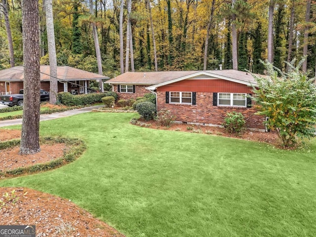 ranch-style home with a front yard