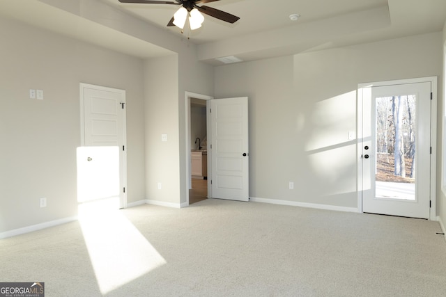 carpeted empty room featuring ceiling fan