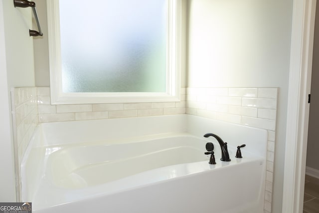 bathroom featuring a tub to relax in