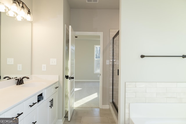 bathroom featuring separate shower and tub, tile patterned flooring, and vanity