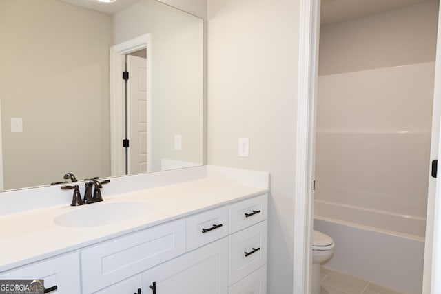 full bathroom featuring tile patterned flooring, vanity,  shower combination, and toilet