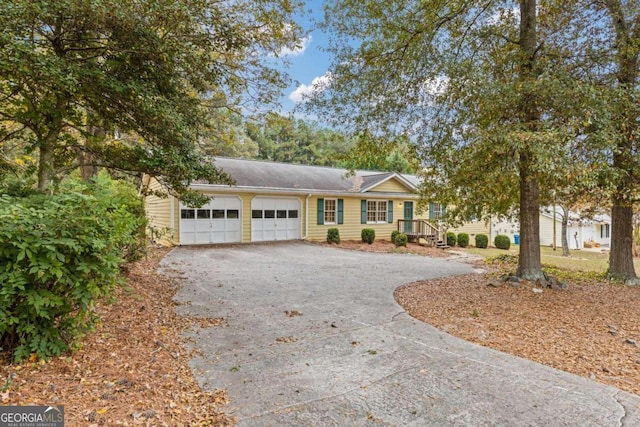 single story home with a garage