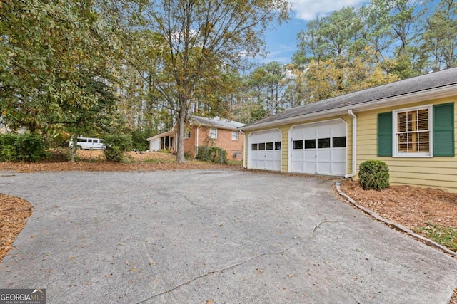 view of side of home with a garage