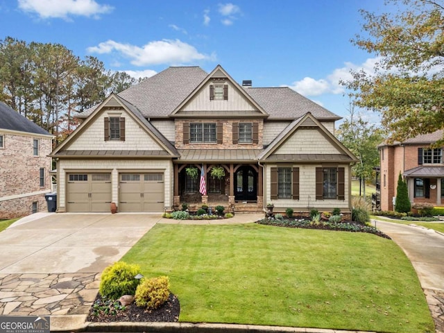 craftsman inspired home featuring a garage, a porch, and a front yard