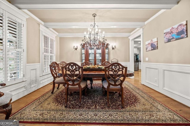 home office with beamed ceiling, light wood-type flooring, and high vaulted ceiling