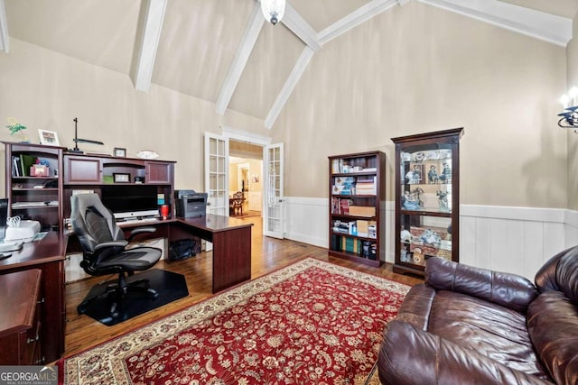 living room with a high ceiling, ceiling fan, light hardwood / wood-style floors, and crown molding