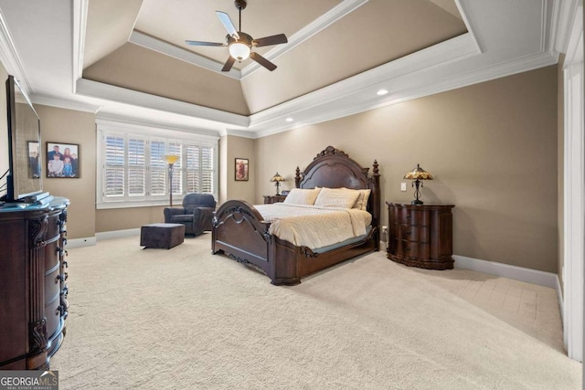 bedroom featuring ornamental molding, ceiling fan, and a tray ceiling