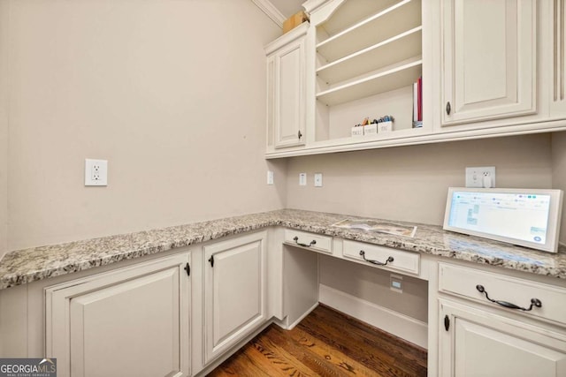 bathroom featuring ornamental molding, hardwood / wood-style flooring, and toilet