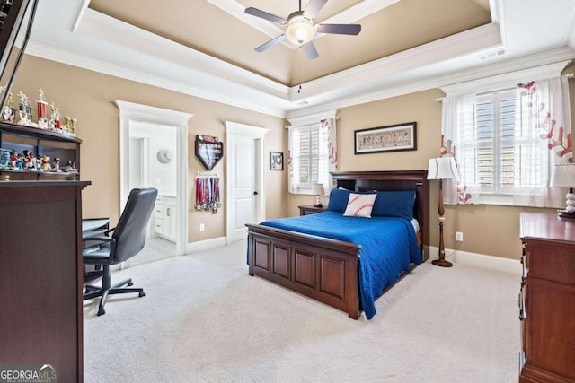 carpeted bedroom featuring ornamental molding, a tray ceiling, and ceiling fan