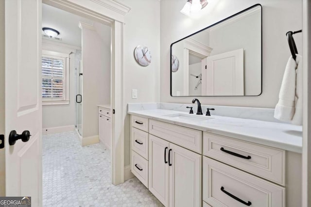 bathroom with an enclosed shower, vanity, and toilet