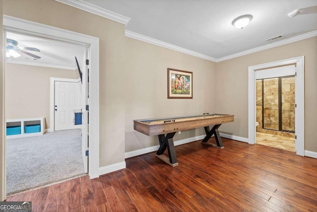 exercise area featuring french doors, carpet flooring, and crown molding