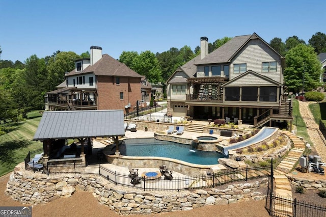 view of swimming pool with a lawn and a gazebo