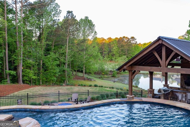 view of swimming pool with a patio, an in ground hot tub, and a gazebo