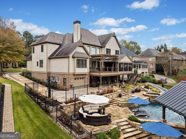 view of patio / terrace with area for grilling, a gazebo, and exterior kitchen