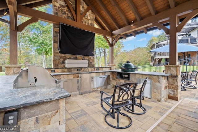 view of swimming pool featuring an in ground hot tub, a gazebo, pool water feature, and a patio area