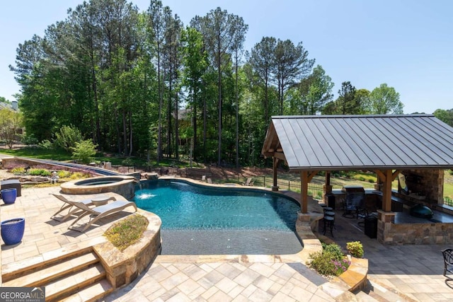 view of pool featuring a water view, an in ground hot tub, a gazebo, and a patio area