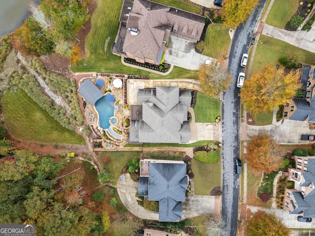 rear view of house with a fenced in pool, a balcony, a sunroom, and a gazebo