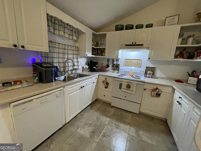 kitchen featuring lofted ceiling, sink, white cabinets, and white appliances