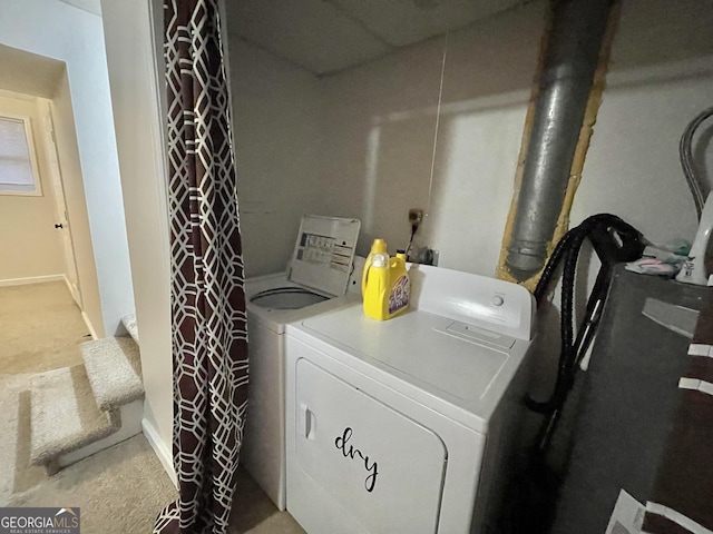 laundry area with washer and clothes dryer and carpet floors