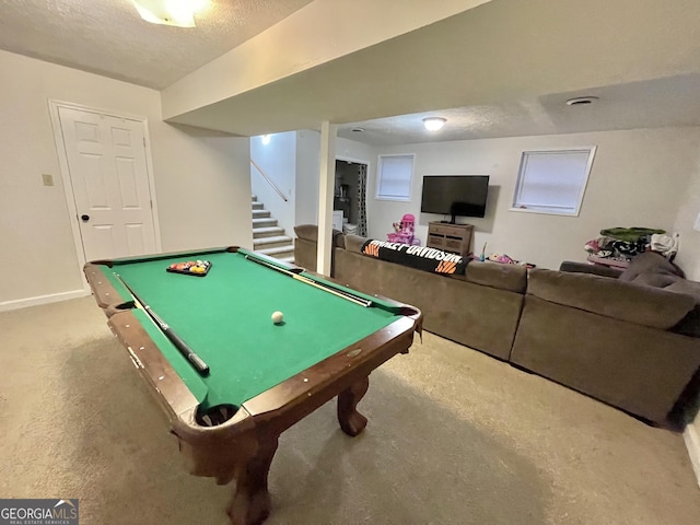 playroom with carpet floors, a textured ceiling, and billiards